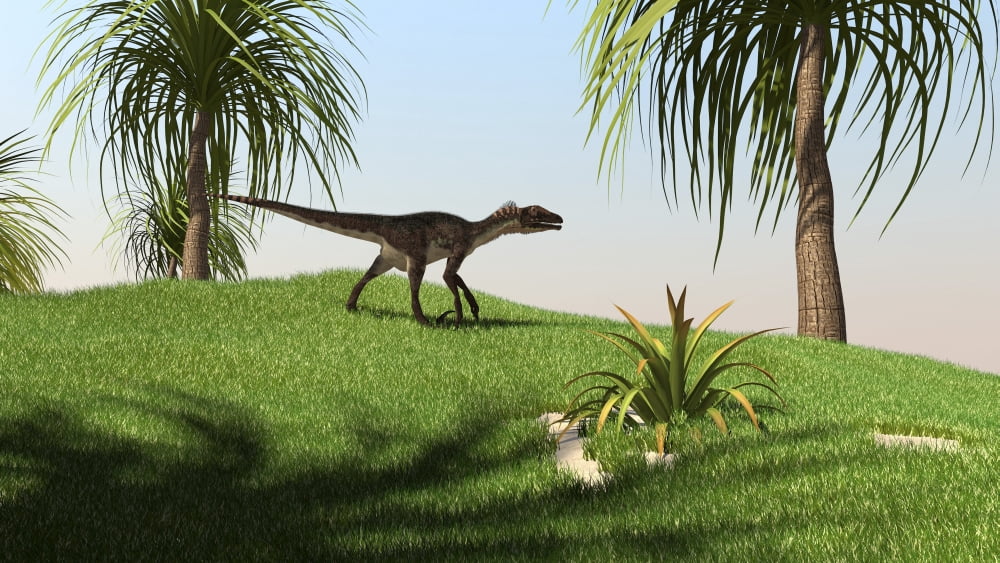Utahraptor walking across a grassy field Canvas Art - Kostyantyn IvanyshenStocktrek Images (38 x 22)