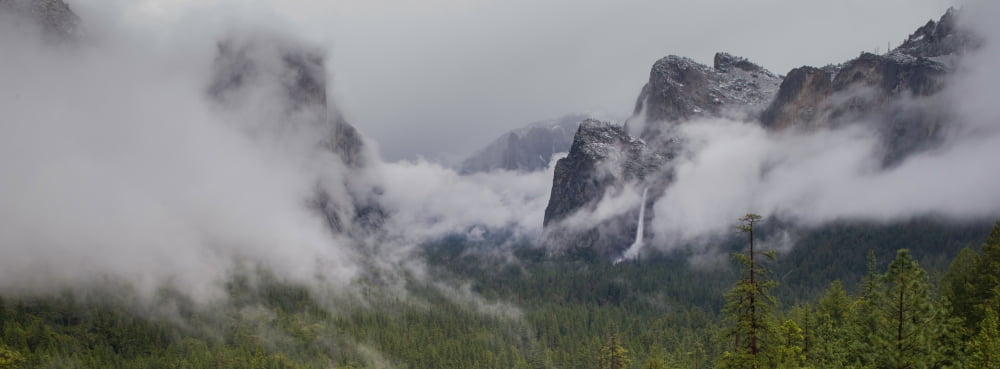 Valley with mountains in fog Yosemite National Park California USA Canvas Art - Panoramic Images (7 x 18)