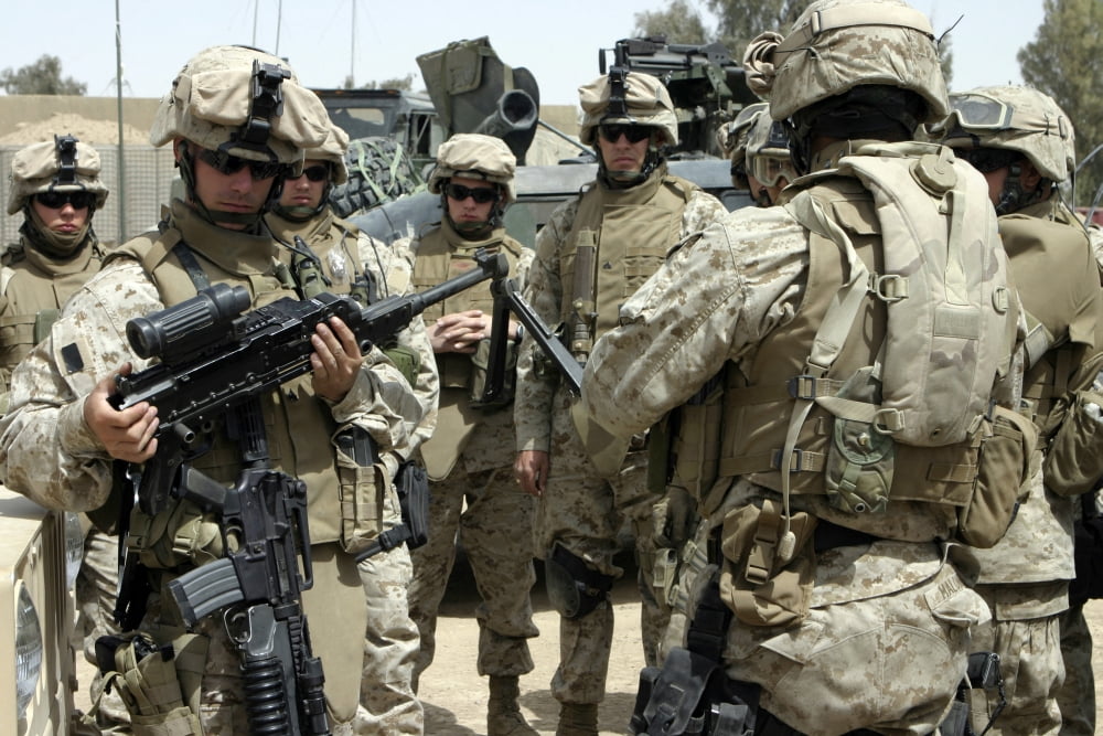 Vehicle commander shows fellow Marines how to properly clean their automatic weapons Canvas Art - Stocktrek Images (34 x 23)