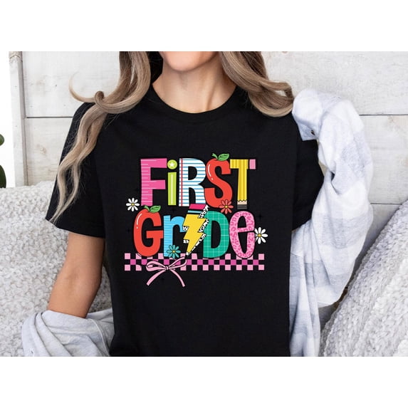 Velto First Grade Teacher Graphic T-shirt Back to School Elementary Classroom Casual Outfit, Full Size S-5XL