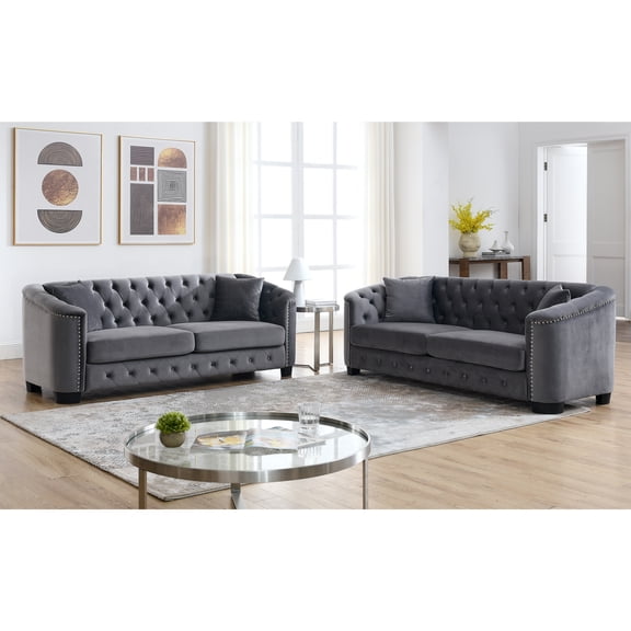 Velvet Chelsfield Sofa Set, featuring extra-deep seat cushions with padded armrests, tufted buttons, and brass studs, complete with throw pillows and plastic legs