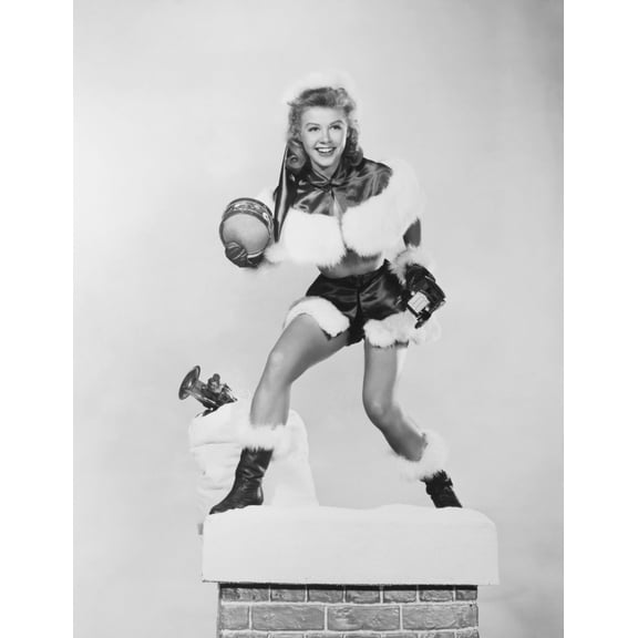 Vera-Ellen Preparing To Slide Down The Chimney To Deliver Christmas Toys Portrait (8 x 10)