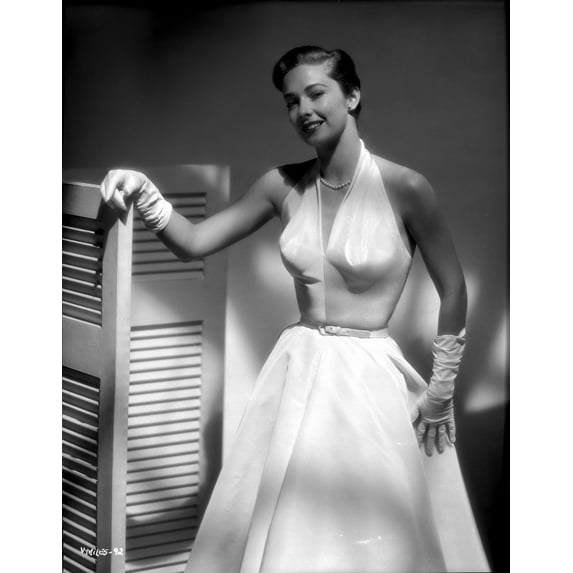 Vera Miles photographed wearing an elegant belted, white organza, deep v-neck, sleevless gown and gloves Photo Print (8 x 10)