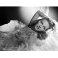 thumbnail image 1 of Vera Zorina laying on white, plush blankets, wearing a sweetheart, sleeveless dress, with tule overlay, beautifully decorated with amzing patterns sewn with sequins Photo Print (8 x 10), 1 of 1