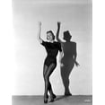 thumbnail image 1 of Vera Zorina wearing black leotard, black stockings, and side-clasped dance shoes, with one arm raised, and looking away from the camera Photo Print (24 x 30), 1 of 1