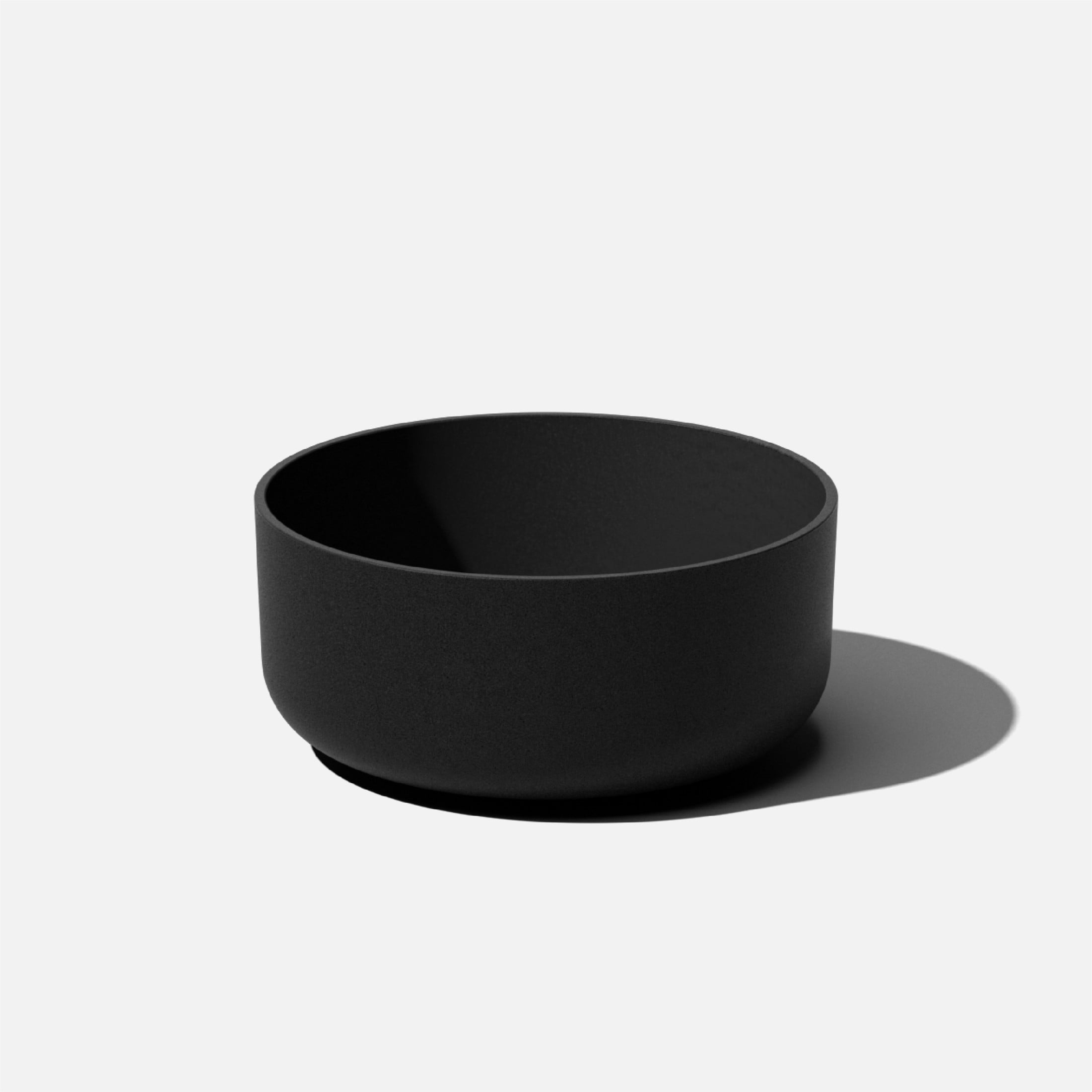 Black Round Plastic-Stone Composite Indoor/Outdoor Planter