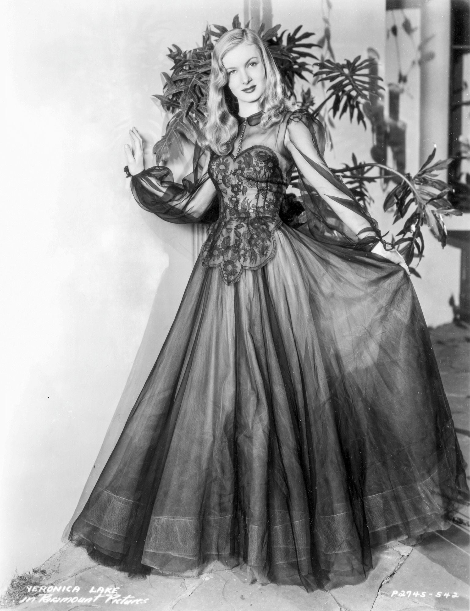 Veronica Lake wearing a dress with a lace bodice Photo Print 24 x