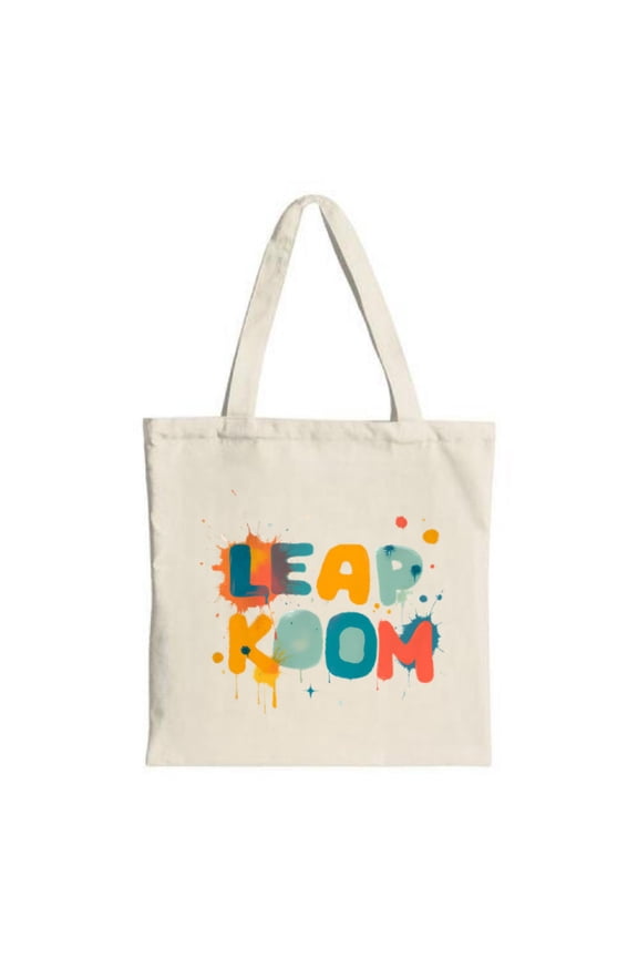 Vibrant " KOOM " tote bag with artistic splatter design in orange blue and teal Perfect for shopping travel and parties