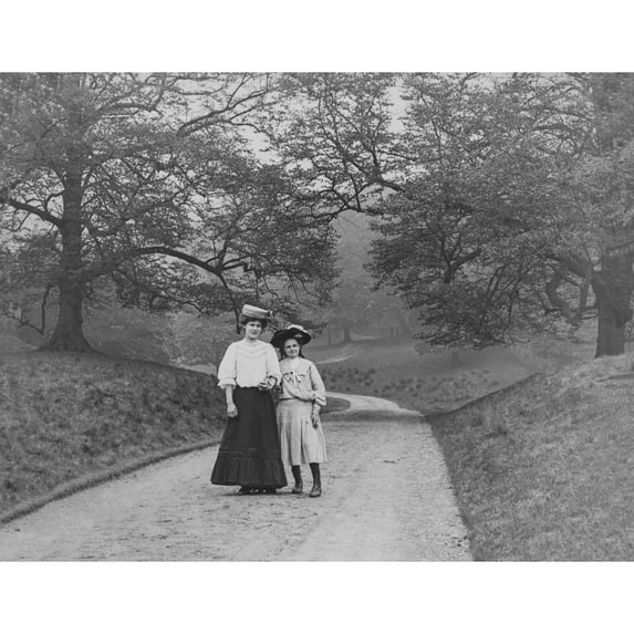 Victorian Lady And Child Walking In The Park Circa 1900 by John Short / Design Pics (19 x 14)