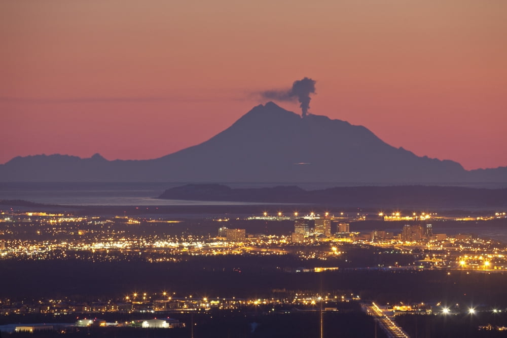 View Of Minor Eruption Of Ash And Steam From Mt Redoubt With Anchorage Alaska In The Foreground During Winter Canvas Art - Calvin Hall Design Pics (17 x 11)
