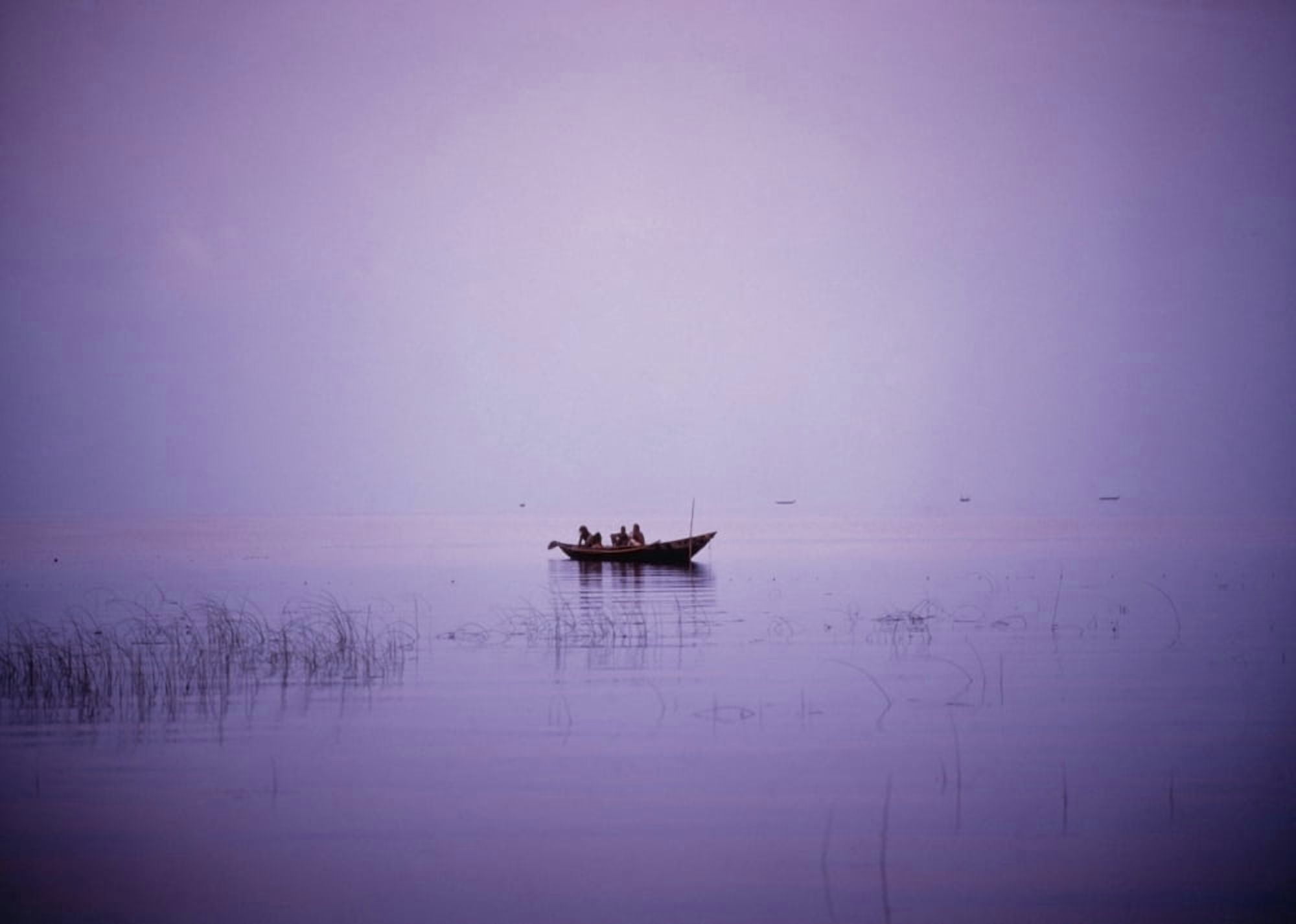 View Of A Boat In A Placid Lake Canvas Art - Ian Cumming Design Pics (32 x 22)