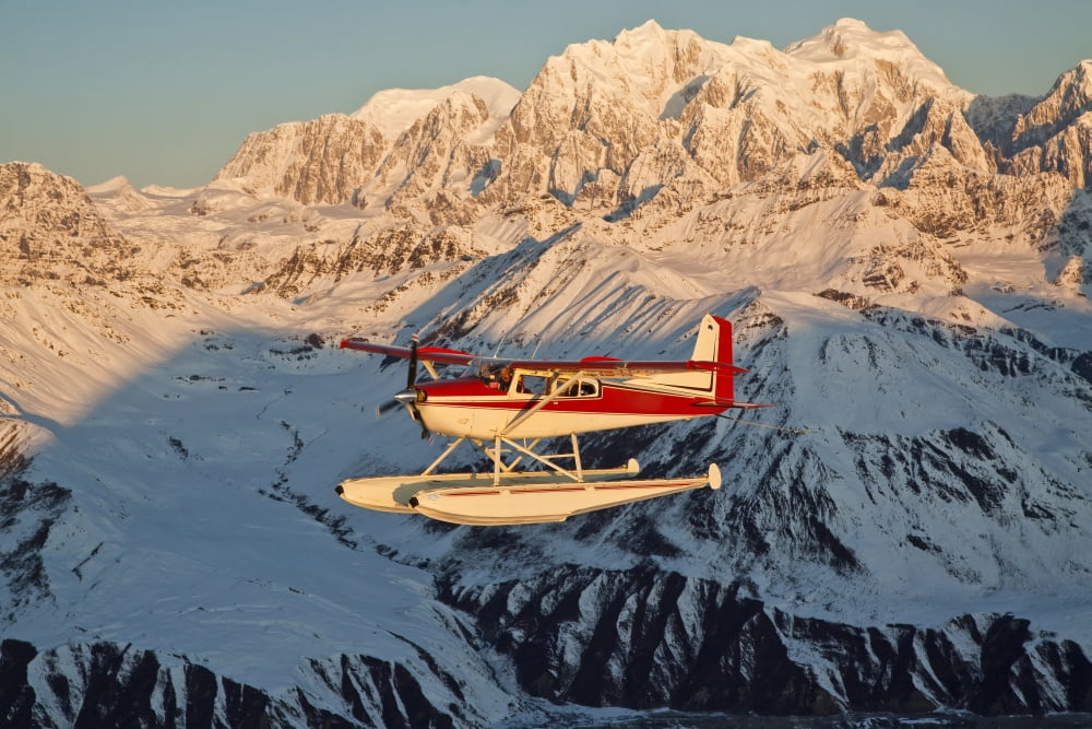 View Of A Cessna 185 Floatplane In Alaska Range Over Ruth Glacier At Sunset Southcentral Alaska Canvas Art - Jeff Schultz Design Pics (34 x 22)