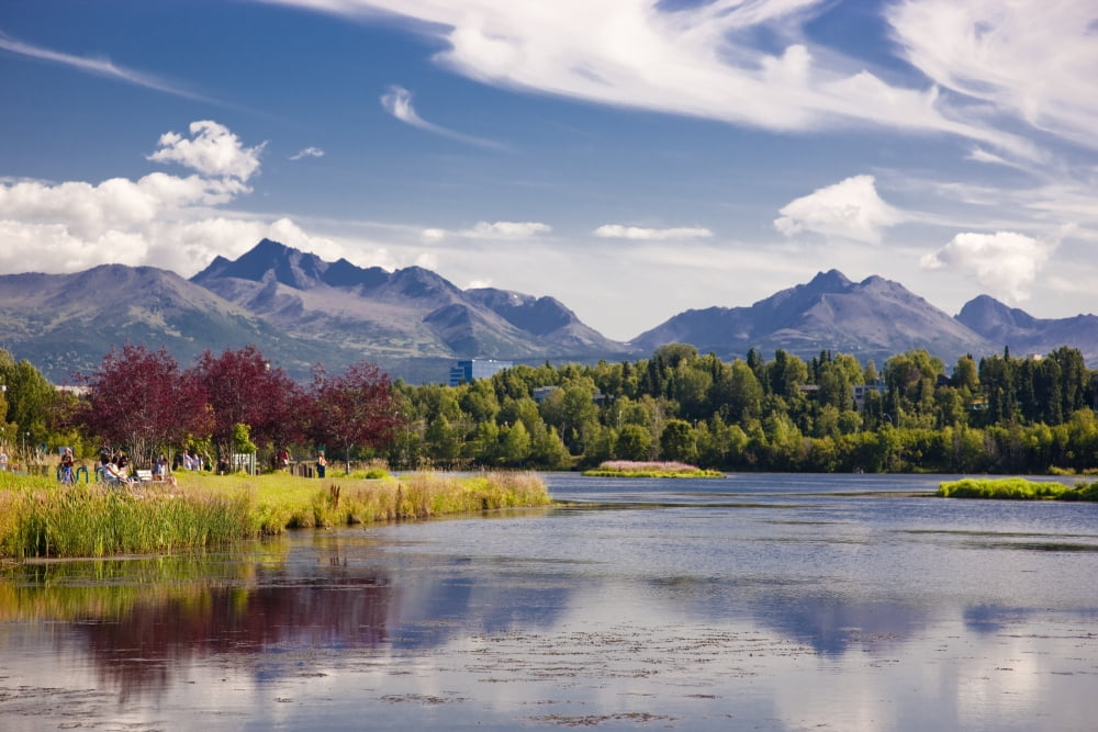 View Over Westchester Lagoon And The Chugach Mountains During Summer Anchorage Southcentral Alaska Canvas Art - Kevin Smith Design Pics (18 x 12)