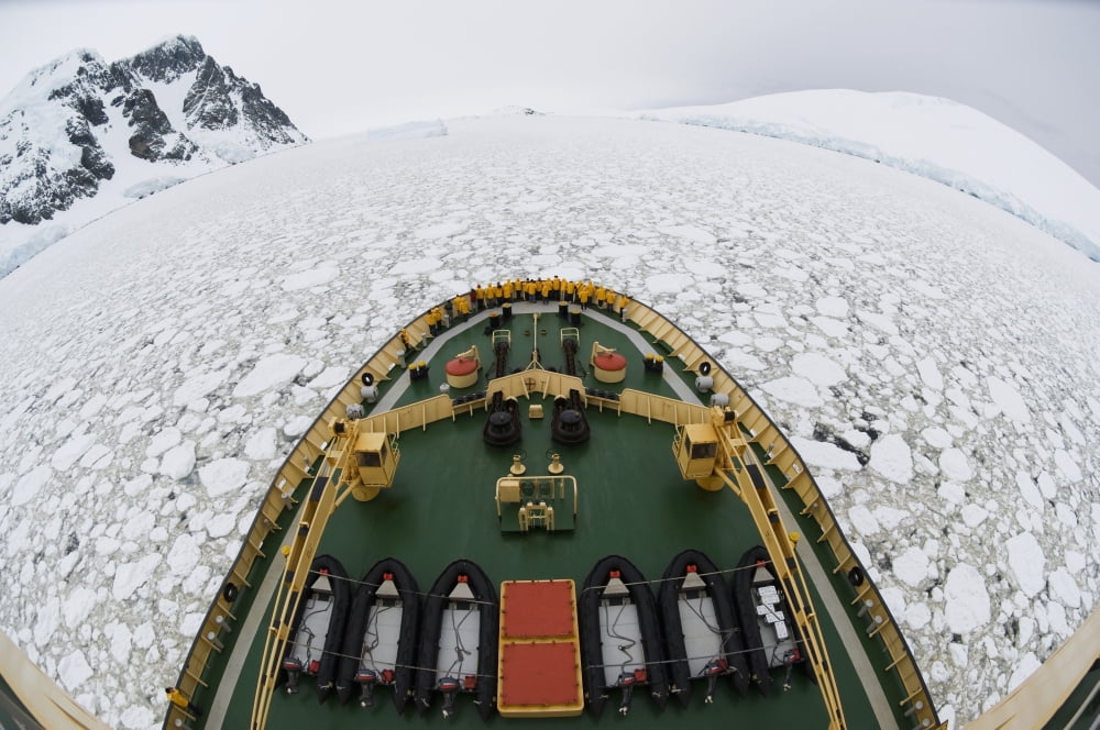 View from the Russian icebreaker Kapitan Klebnikov cruising through pancake ice in Penola Strait Antarctica Canvas Art - Daisy Gilardini Design Pics (19 x 12)