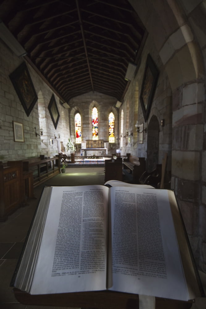 View of the interior of a church with stained glass windows and an open Bible Bamburgh Northumberland England Canvas Art - John Short Design Pics (12 x 19)