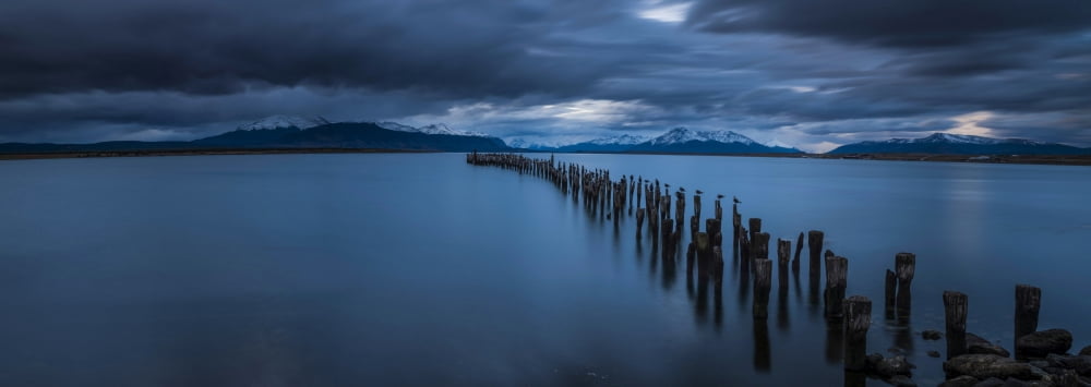 View of lake at dusk with snowcapped mountain in the background Ultima Esperanza Puerto Natales Patagonia Chile Canvas Art - Panoramic Images (36 x 12)