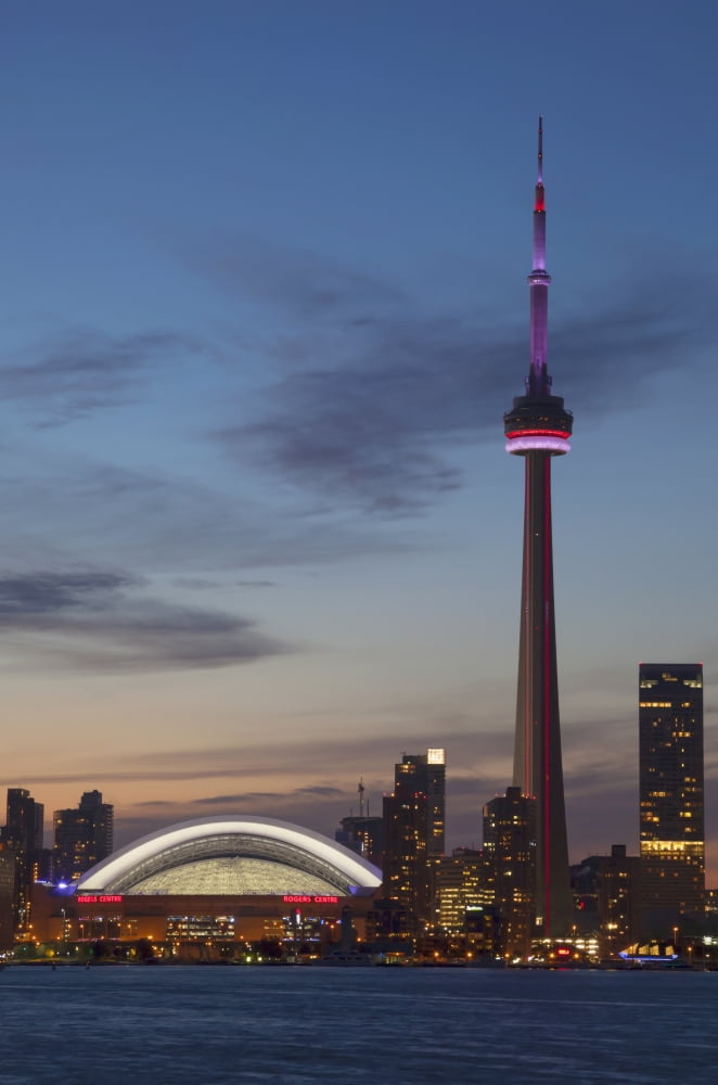 View over lake ontario of the downtown toronto skyline and cn tower illuminated at duskToronto ontario canada Canvas Art - Mark Thomas Design Pics (12 x 19)
