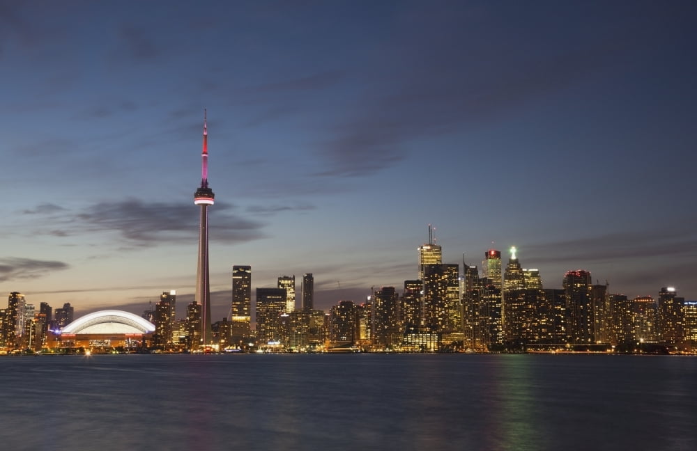 View over lake ontario of the downtown toronto skyline and cn tower illuminated at duskToronto ontario canada Canvas Art - Mark Thomas Design Pics (19 x 12)