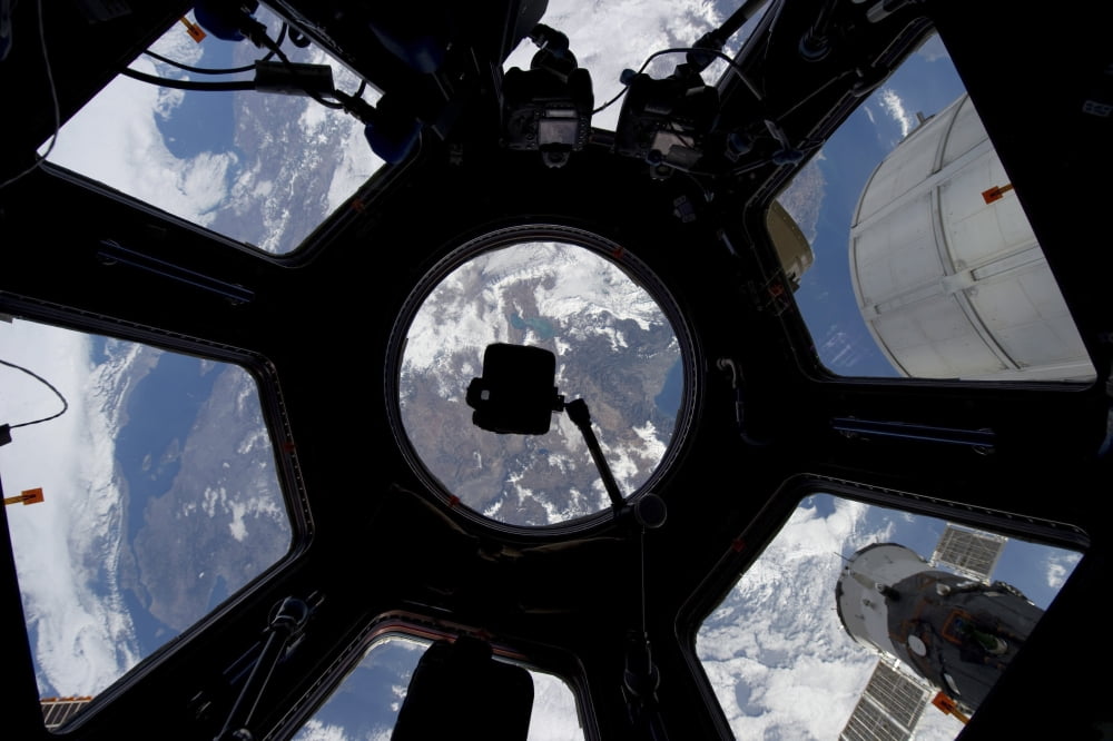 View of Earth through the Cupola on the International Space Station Canvas Art - Stocktrek Images (35 x 23)