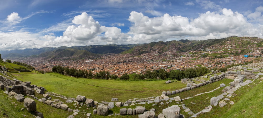 View of Inca archaeological site and cityscape Saksaywaman Cusco Urubamba Province Cusco Region Peru Canvas Art - Panoramic Images (16 x 36)