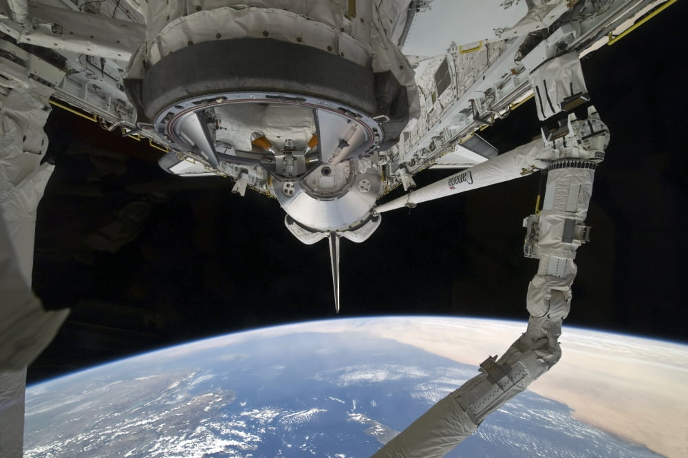 View of Space Shuttle Discovery over Earths horizon Canvas Art - Stocktrek Images (34 x 23)