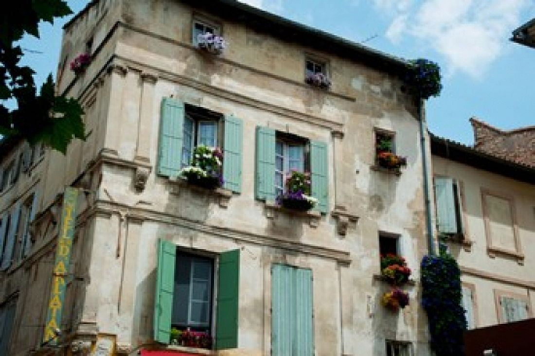 View of an old building with flower pots on each window Rue Des Arenes Arles Provence-Alpes-Cote dAzur France Canvas Art - Panoramic Images (36 x 24)