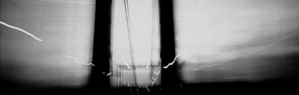 View of blurred bridge and lights Canvas Art - Panoramic Images (12 x 36)