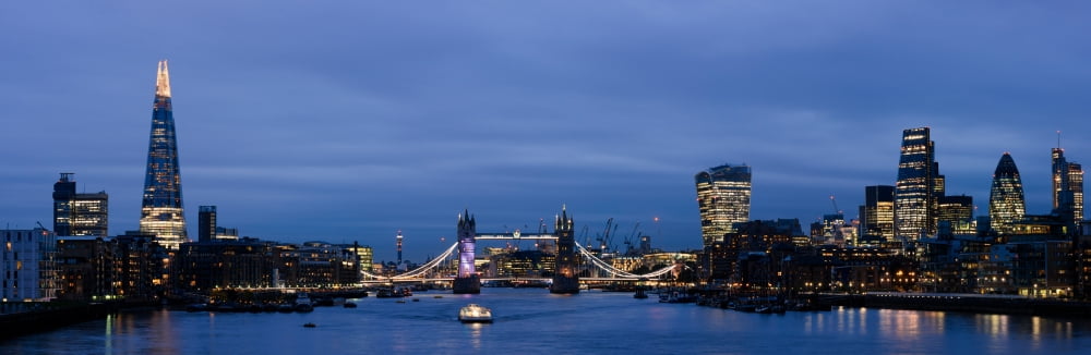 View of buildings at the waterfront during night City of London Southwark London England Canvas Art - Panoramic Images (12 x 36)