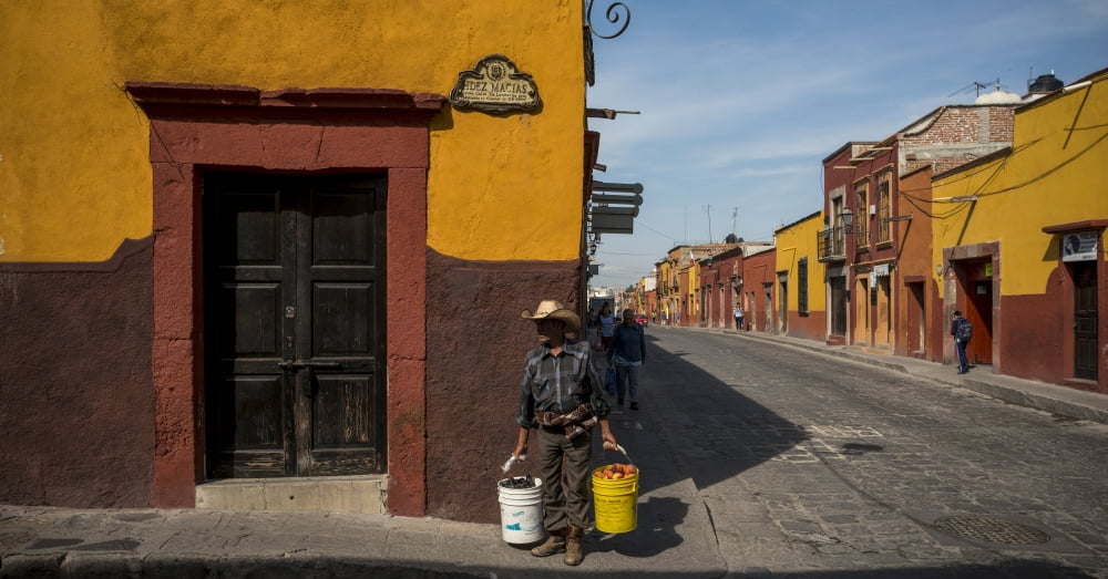 View of houses along a street San Miguel De Allende Guanajuato Mexico Canvas Art - Panoramic Images (36 x 12)