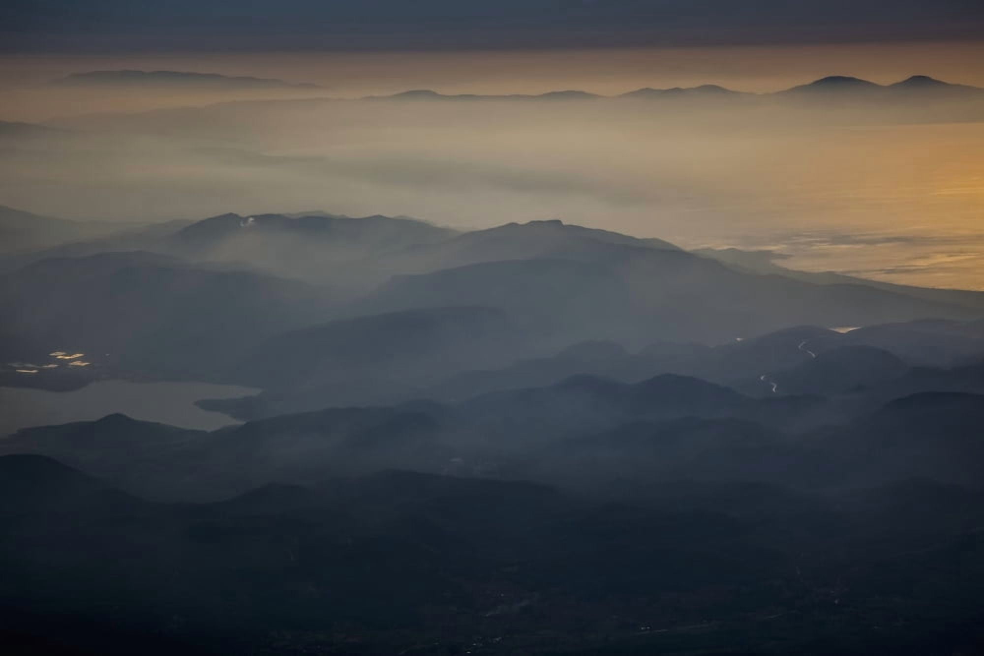 View of mountains and clouds at sunset along the coastline Greece Canvas Art - Reynold Mainse Design Pics (19 x 12)