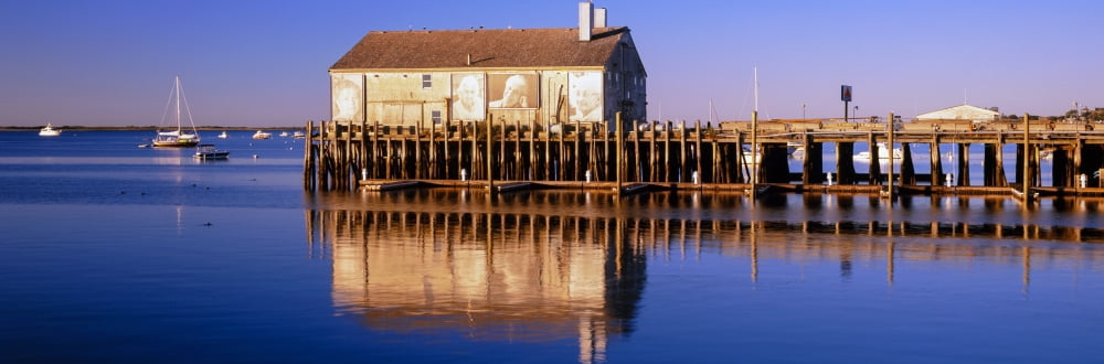 View of pier in ocean Provincetown Cape Cod Barnstable County Massachusetts USA Canvas Art - Panoramic Images (6 x 18)