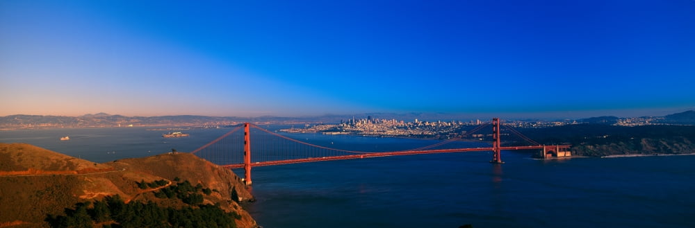 View of the Golden Gate Bridge and city skyline at sunset from the Marin Headlands San Francisco California Canvas Art - Panoramic Images (27 x 9)