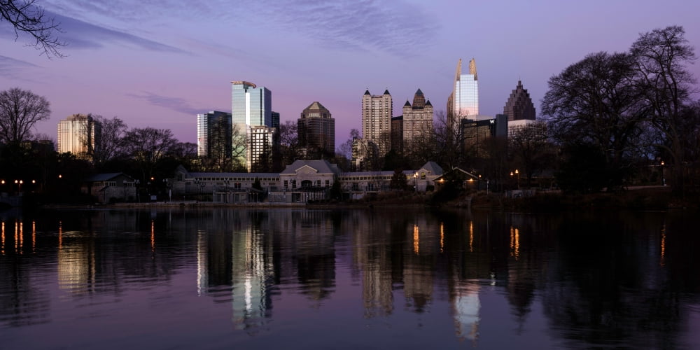 View of the Midtown skylines and lake at dusk Piedmont Park Atlanta Fulton County Georgia USA Canvas Art - Panoramic Images (12 x 36)