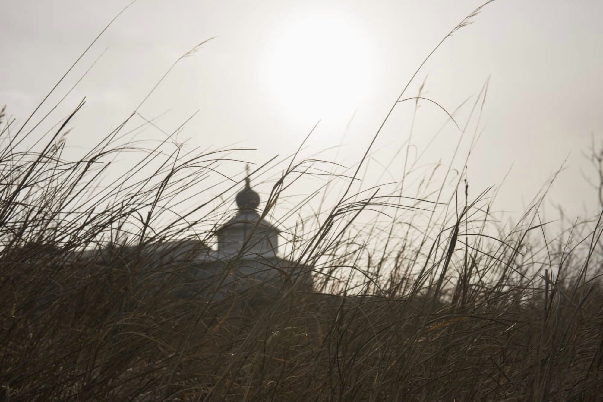 View of the St Nicholas Russian Orthodox Church through tall grasses in Igiugig Alaska Canvas Art - Carl Johnson Design Pics (19 x 12)
