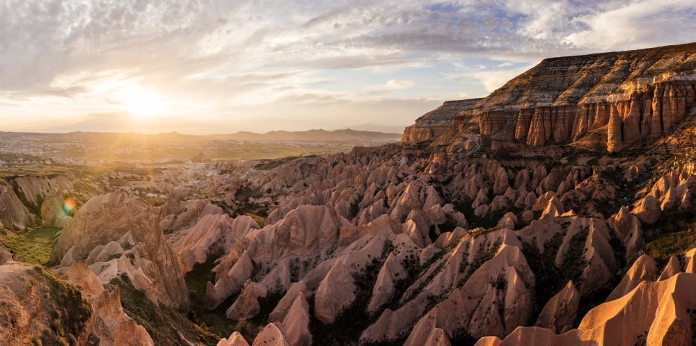 View of rock formations from Aktepe Hill at sunset over Red Valley Goreme National Park Cappadocia Central Anatolia Region Turkey Canvas Art - Panoramic Images (12 x 24)