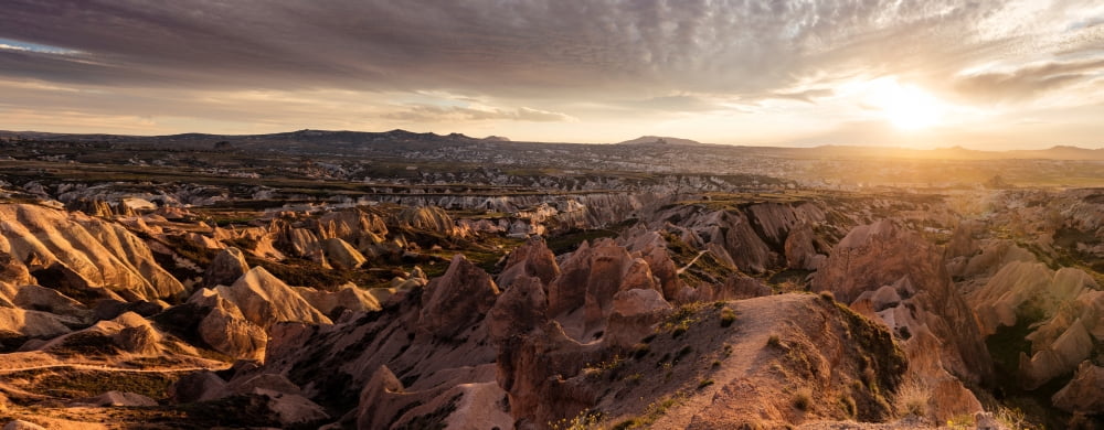 View of rock formations from Aktepe Hill at sunset over Red Valley Goreme National Park Cappadocia Central Anatolia Region Turkey Canvas Art - Panoramic Images (6 x 15)