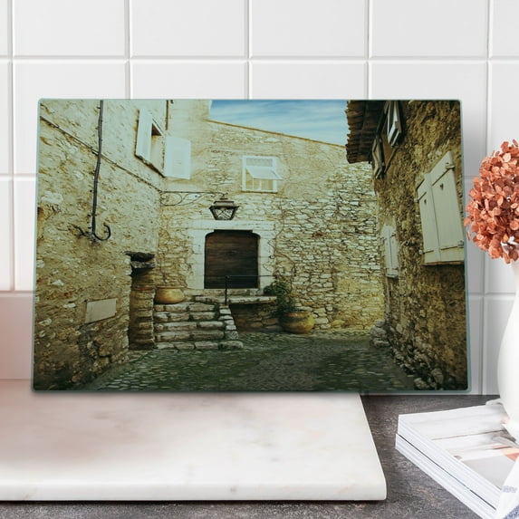 Vintage Cutting Board, Confined Cobble Street Sandstone Houses and Shutter Windows Travel Tourist Place Image, Decorative Tempered Glass Cutting and Serving Board, Large Size, Cream, by Ambesonne