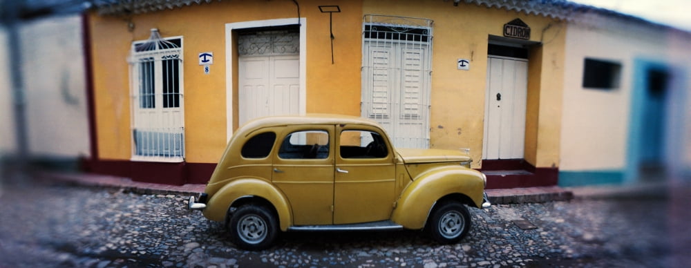 Vintage car on the cobblestone street Trinidad Sancti Spiritus Cuba Canvas Art - Panoramic Images (6 x 15)