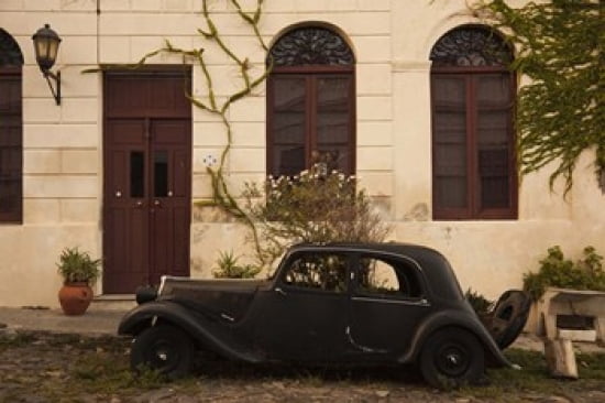 Vintage car parked in front of a house Calle De Portugal Colonia Del Sacramento Uruguay Canvas Art - Panoramic Images (24 x 16)