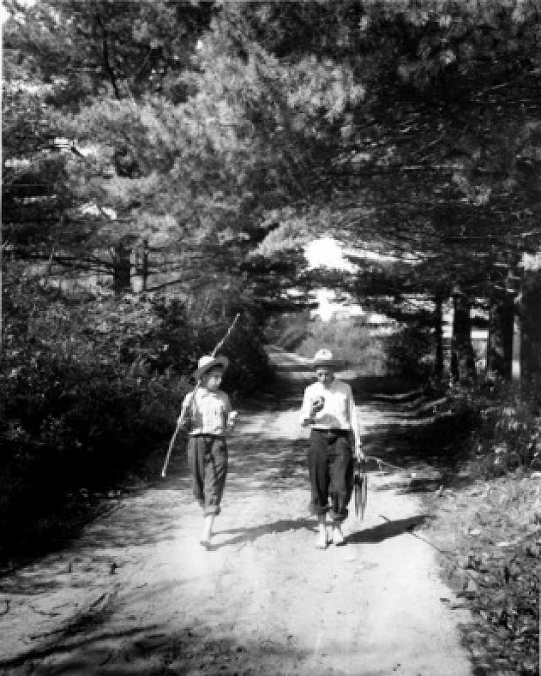 Vintage photograph of boys on forest footpath carrying improvised fishing rod and catch of fish Canvas Art - (18 x 24)