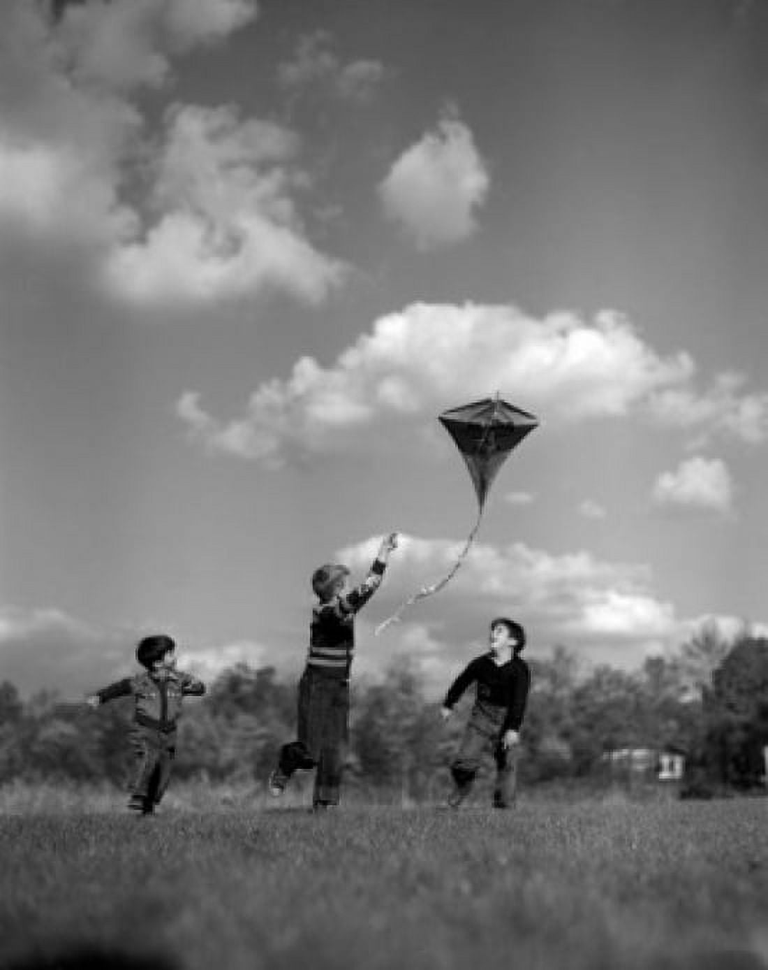 Vintage photograph of children playing with kite Canvas Art - (18 x 24)