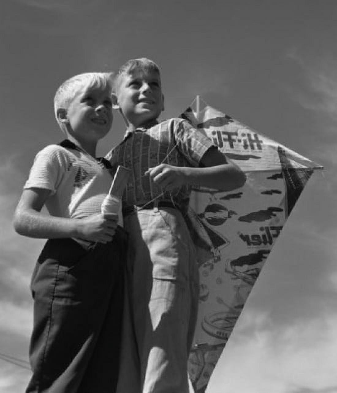 Vintage photograph of children standing with kite Canvas Art - (24 x 36)