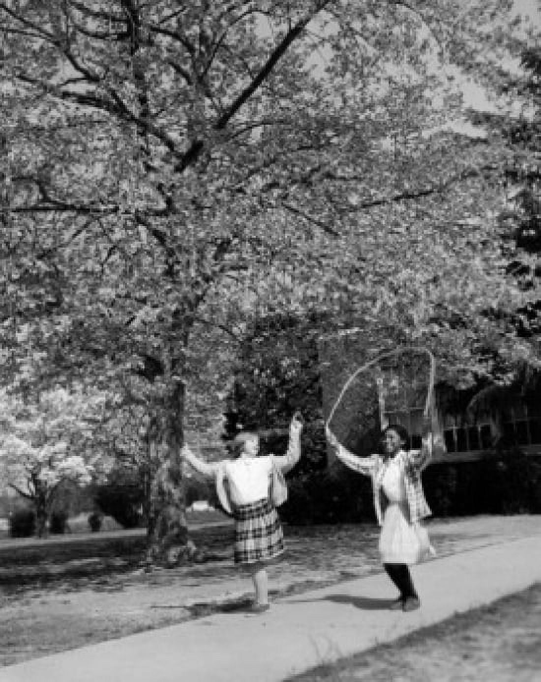 Vintage photograph of girls jumping with jump-rope in park Canvas Art - (18 x 24)