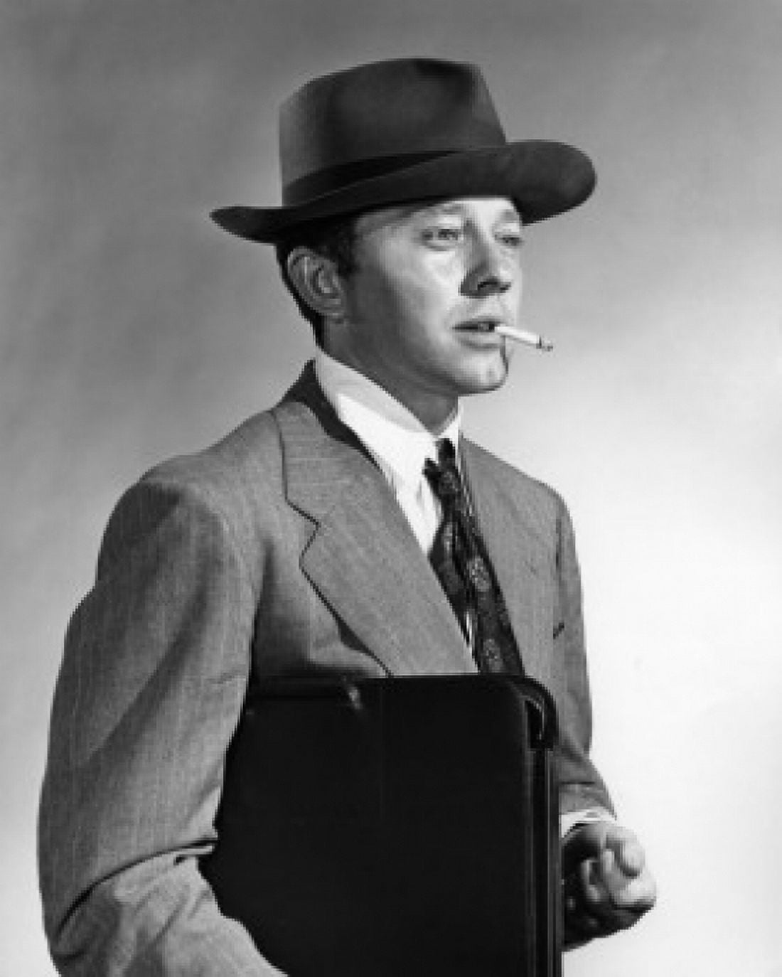 Vintage photograph of man with briefcase smoking cigarette Canvas Art - (24 x 36)