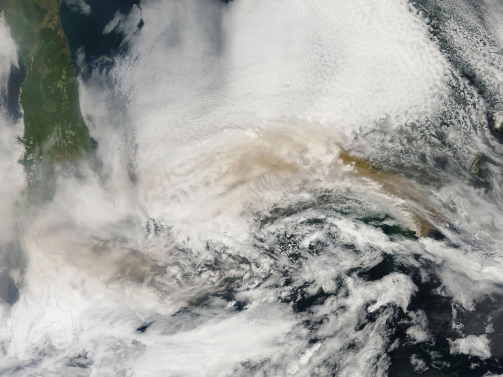 Volcanic ash plumes from Sarychev Peak blowing across the Sea of Okhotsk and the island of Sakhalin Canvas Art - Stocktrek Images (33 x 25)