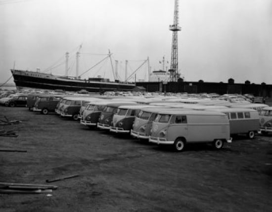 Volkswagen vans in parking lot with nautical vessel in background Canvas Art - (24 x 36)