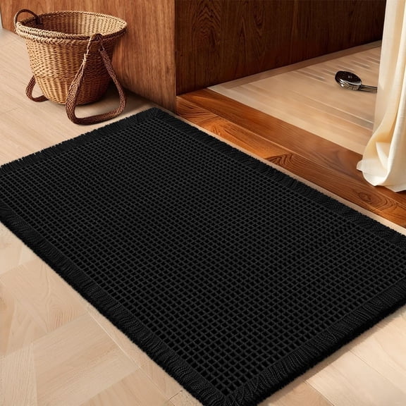 HAKUNA Waffle Bath Mat Black 24"x17", Boho Woven Modern Bath Rug Mats, Absorbent Non Slip Bathroom Floor Mat, Soft Washable Bath Rugs with Tassels for Bathroom, Bedroom, Kitchen, Shower, Tub