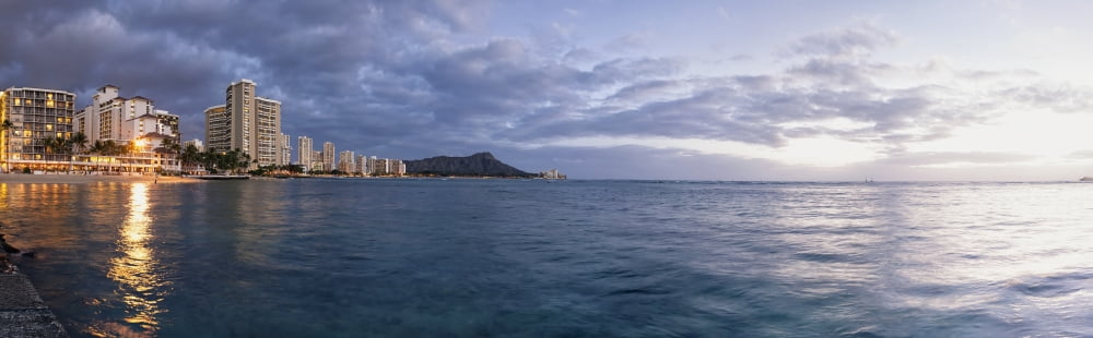 Waikiki Beach basking in the last moments of a days sunlight Honolulu Oahu Hawaii United States of America Canvas Art - Ian Ludwig Design Pics (38 x 12)
