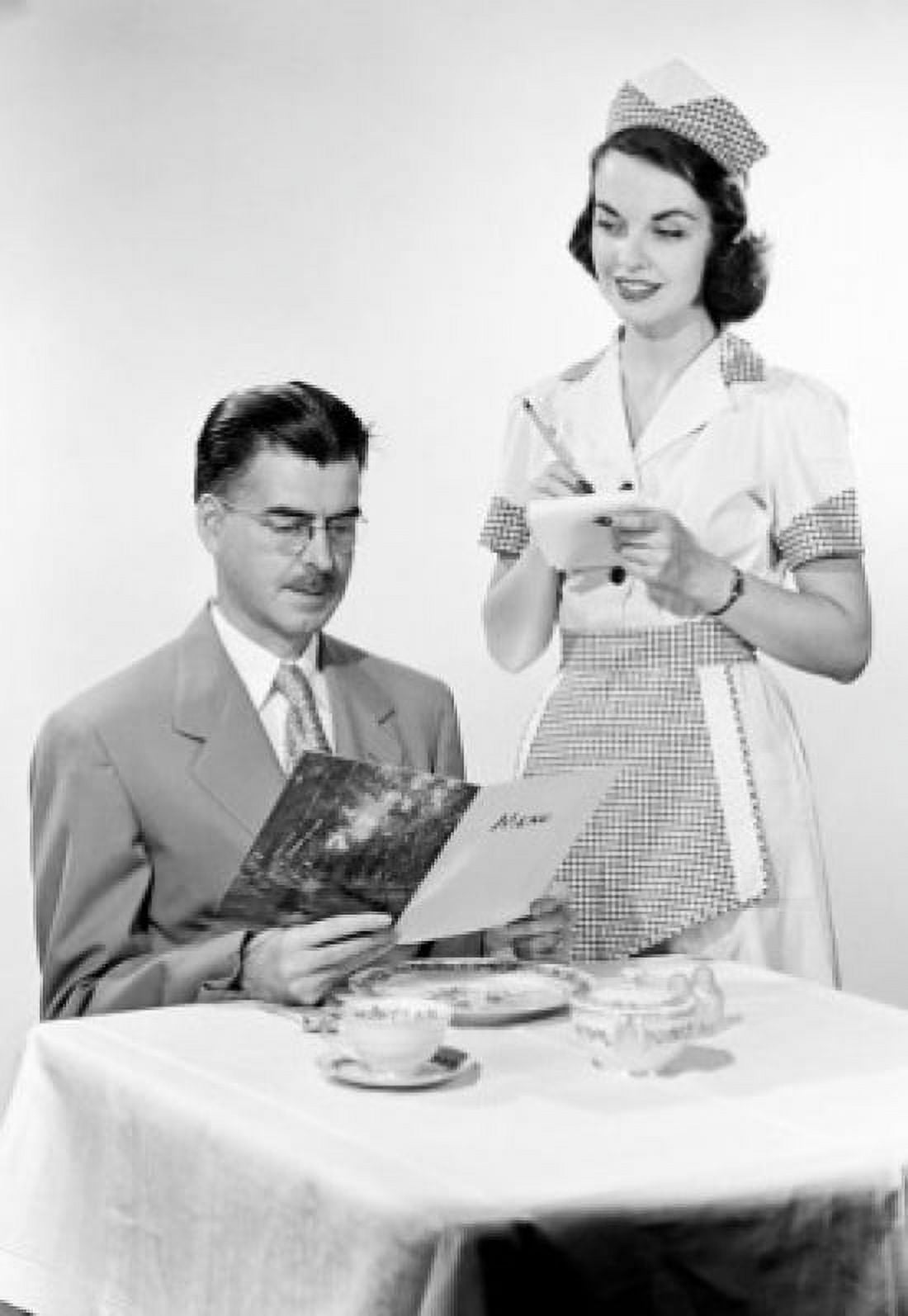 Waitress serving man at restaurant table Canvas Art - (18 x 24)