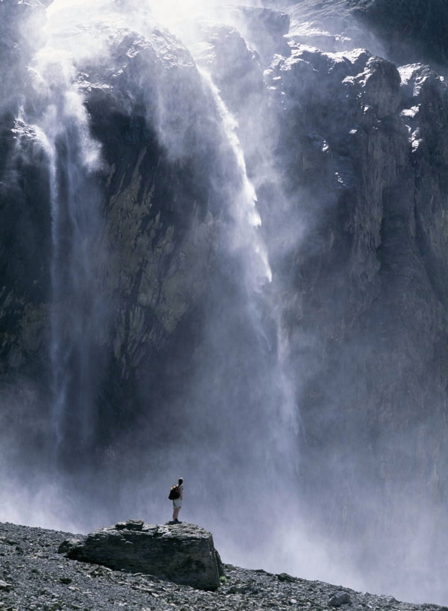 Walker Beneath Waterfall In The Cirque De Gavarnie Canvas Art - Ian Cumming Design Pics (24 x 32)